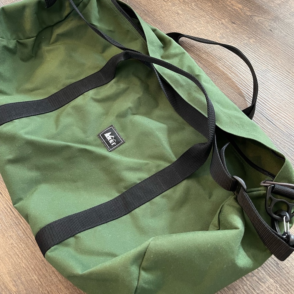 Green & black REI “road-tripper” duffle bag